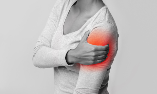 cropped view of a woman holding her arm